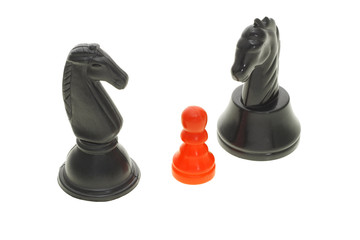 Two different black knights and a red pawn on white background