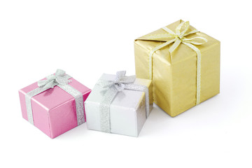Three gift boxes decorated with bow ribbons