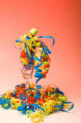 Party time with wine flute and streamers.