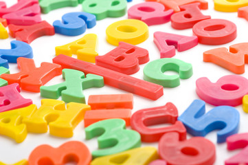 A group of colorful plastic alphabet letter magnets