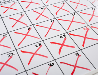 A calendar with every date x-d out or marked out,