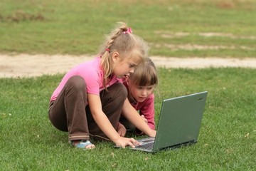 two girls with laptop