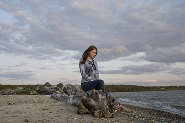 The lonely girl on the bank of lake