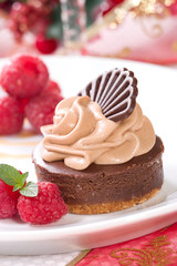 Delicious chocolate cheesecake, raspberries and mint.