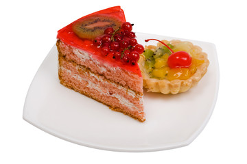 Sweet cakes with fruit on a white background