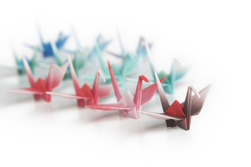 A group of origami cranes on a white background