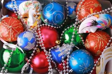 Colorful christmas bulbs, mask, beads and streamer