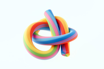 Close-up of a knot shaped rainbow rubber eraser