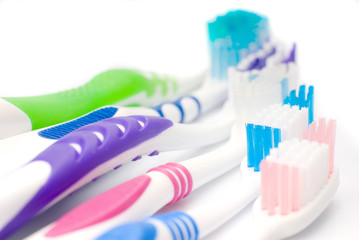five toothbrushes multicolored