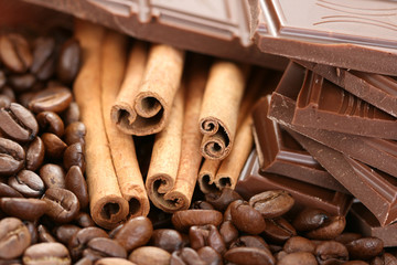 arrangement of chocolate coffee and cinnamon sticks