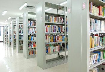 bookshelves in library - obrazy, fototapety, plakaty