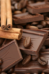 arrangement of chocolate coffee and cinnamon sticks