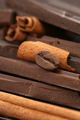 arrangement of chocolate coffee and cinnamon sticks