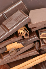 arrangement of chocolate coffee and cinnamon sticks