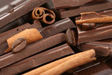 arrangement of chocolate coffee and cinnamon sticks