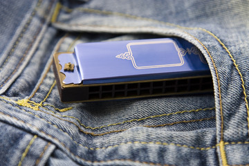 Blue harmonica in pocket