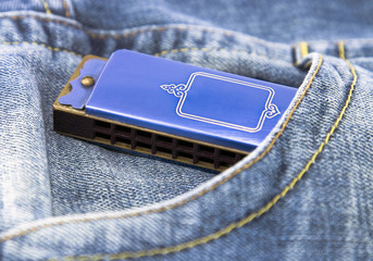 Blue harmonica  in pocket