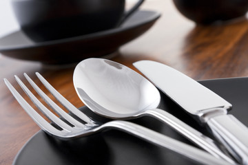 Knife, fork and spoon table setting in cafe