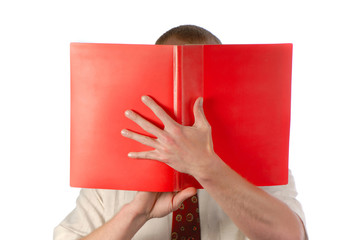 businessman looks  folder of red color with documents