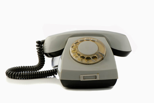 old disk phone on  white background