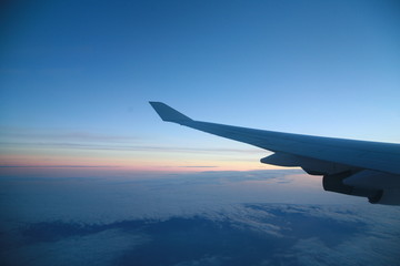 Fototapeta na wymiar wings of an airplane in the sky............