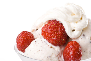 Ice-cream with a strawberries in a glass on a white background.