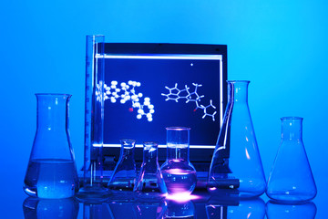 Labor scene with testtubes and beaker and a L