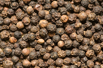 Background of black pepper - extreme close up
