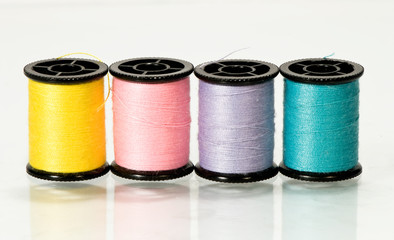 colorful threads isolated over white background