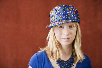 Teenage girl wearing a hat with sequins