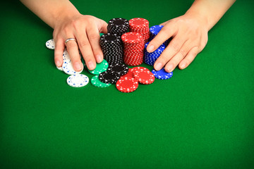 Player pushing chips into the pot going "all in".