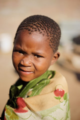 african boy living in a very poor community