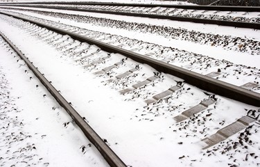 railway tracks covered by snow