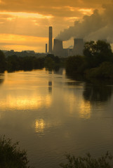 Misty sunrise over a power station - portrait orientation
