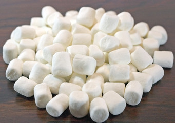 A pile of minimarshmallows on a tabletop