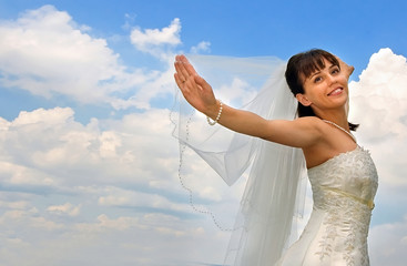 bride on the cloudy sky background