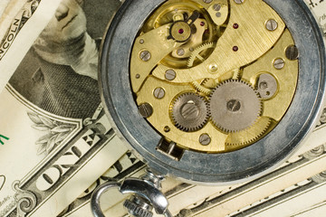 Watch mechanism and dollar bills (“time is money” concept)