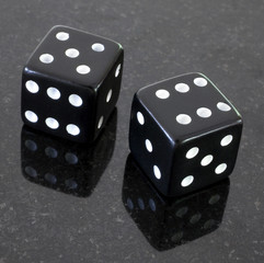 a pair of dice that have rolled an eleven