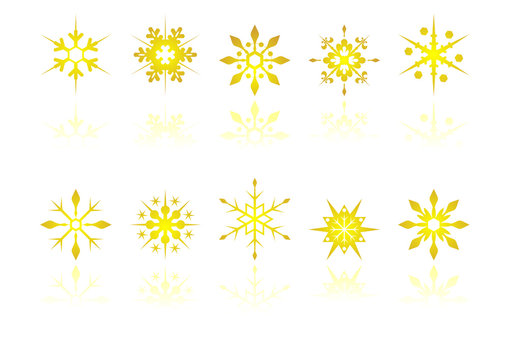 Golden snow crystals with reflection over white background
