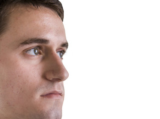 Fototapeta premium A young serious businessman looking into copyspace.