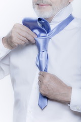 windsor necktie lesson doing by an handsome man