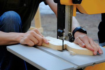 Close up of  man shaping a wood piece