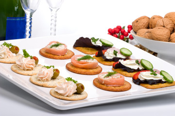 Tray with fresh sandwiches on holiday table.