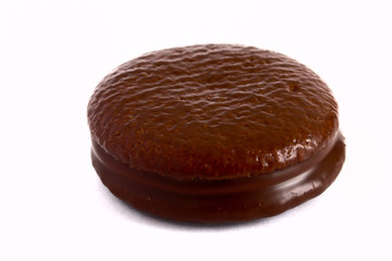 Cookies in chocolate glaze on a white background