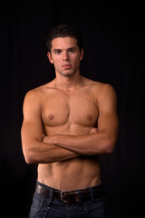Fototapeta premium young sensual man on a black background