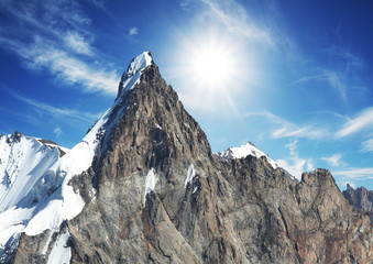 Mountain peak on sunny background