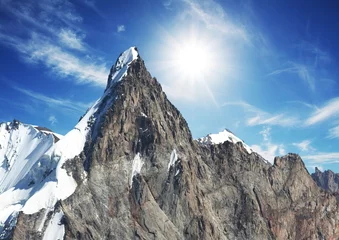 Gordijnen Mountain peak on sunny background © Galyna Andrushko