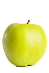 Green delicious apple on a white background