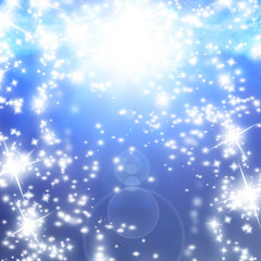 Fototapeta na wymiar bright sparkles on a soft blue background