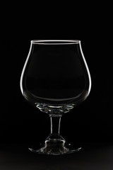 empty glass against black background